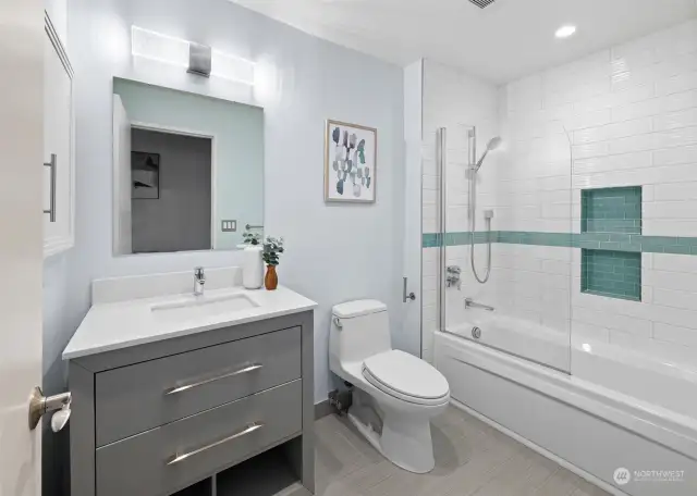 A full-sized upstairs bathroom that is light and bright, offering a fresh and airy atmosphere with modern finishes.