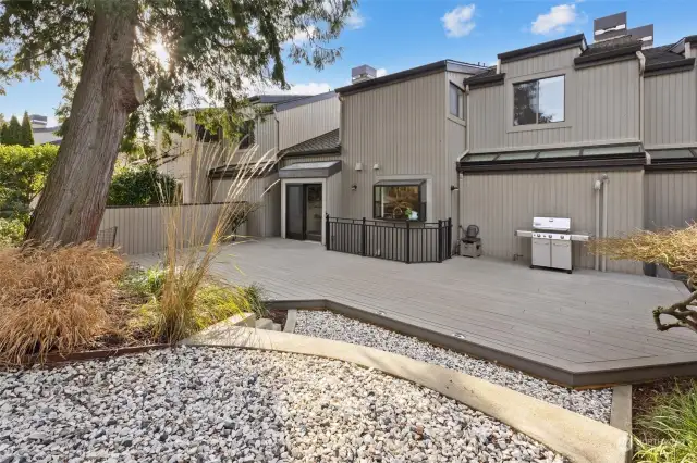 A rare outdoor retreat featuring durable composite decking, a charming garden space, and exceptional privacy for relaxation or entertaining.