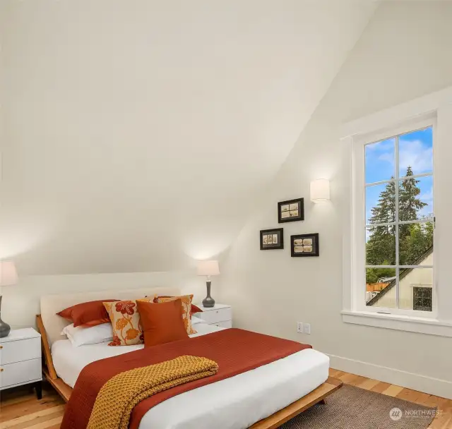 The second of two vaulted ceiling bedrooms on the third floor