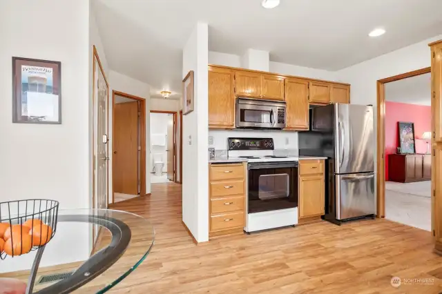 Newer stainless fridge and over the stove microhood.