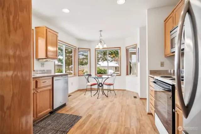 Beautiful, open kitchen with eat-in area flooded with natural light.