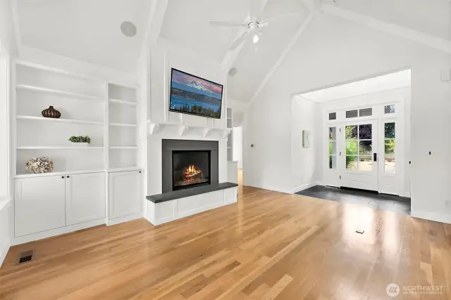 Looking Towards the Front Door. Open Floor Plan with Custom Built-Ins and Hardwood Floors.