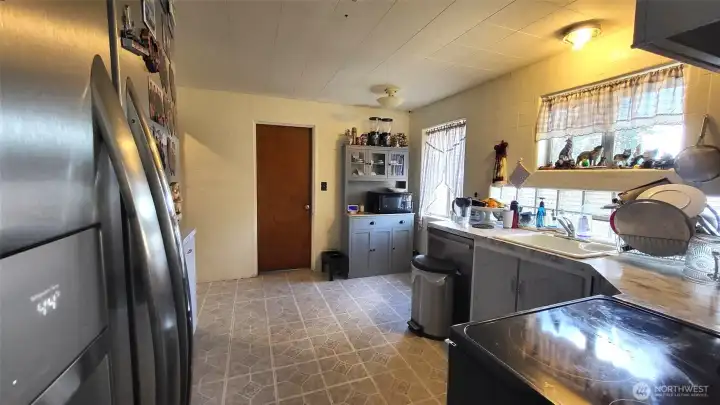 Facing kitchen from dining room area