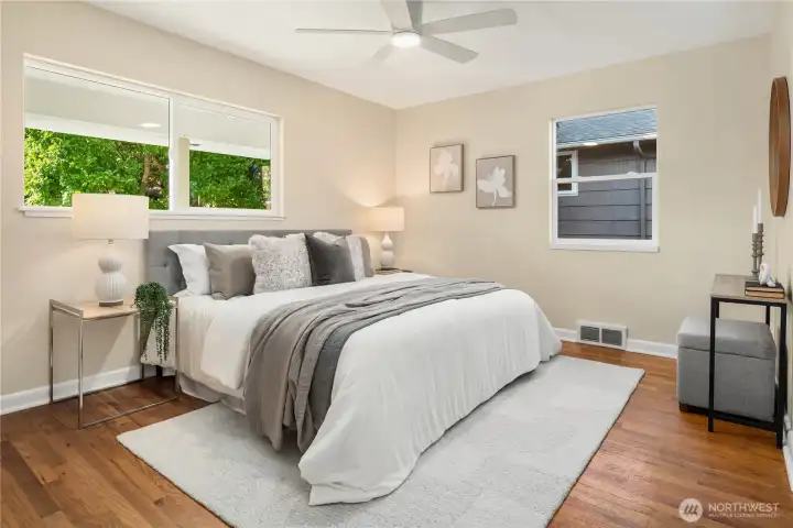 The bedrooms are all very large and can each easily handle king sized beds. This is the first of the two main floor bedrooms off the west side of the house.