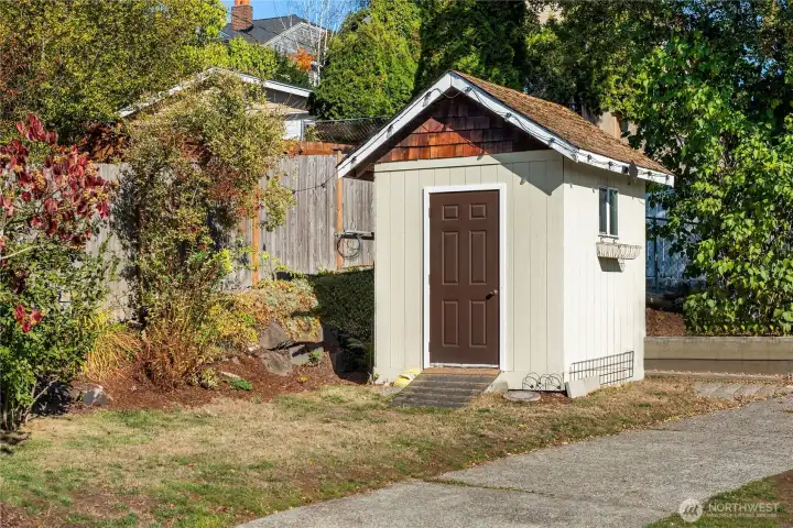 A garden shed sits off the back corner of the lot.