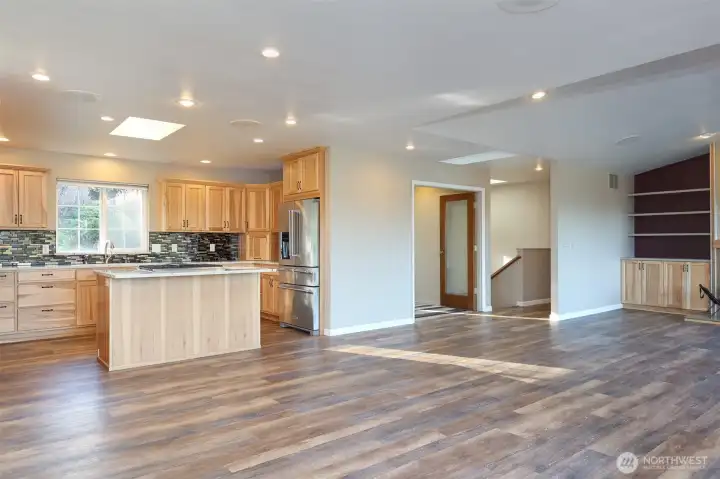 Great room with vaulted ceilings and 4 skylights