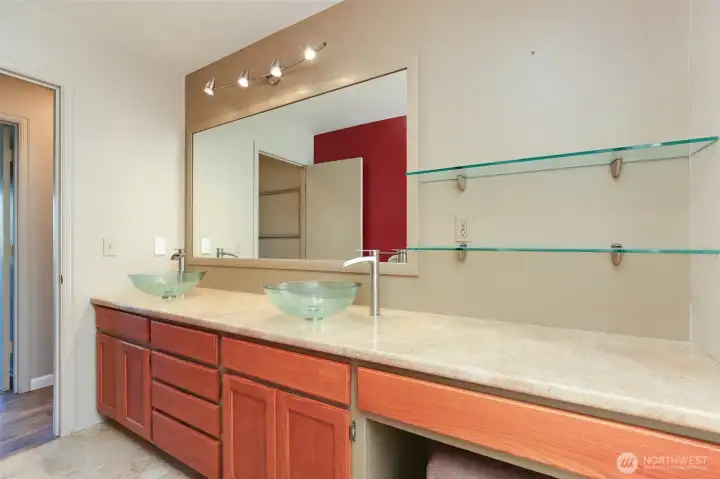 Spare bathroom with double sinks and large countertop