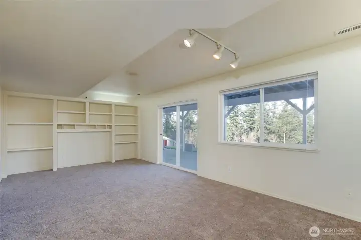 Sliding glass door downstairs to private deck and view.