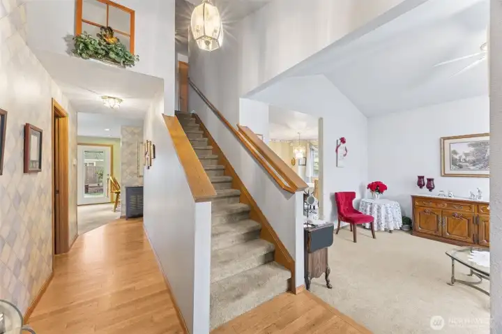 Lovely entry way with hardwood floors, bright lighting and vaulted ceilings in both entry & formal living areas.