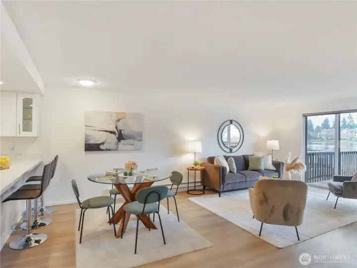 Generous family room flows to lakefront deck.