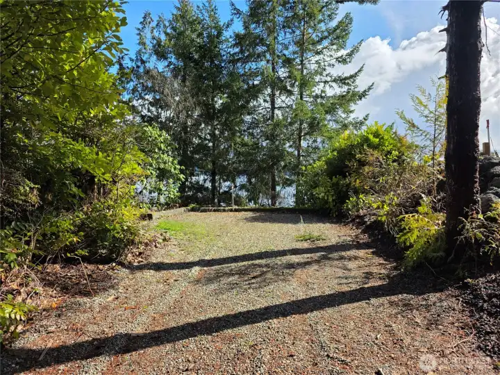 Parking pad for RV, boat, or extra parking for visitors.