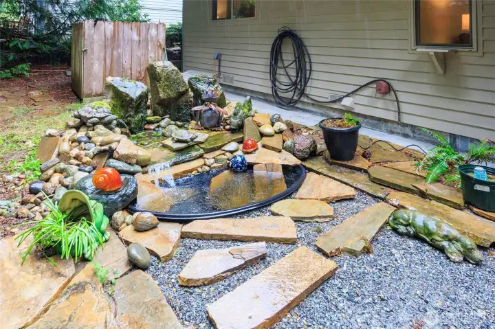 Waterfall/pond w/stone patio area.