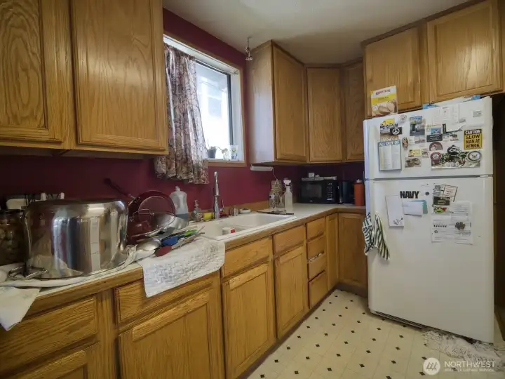 U-shaped kitchen provides ample storage.