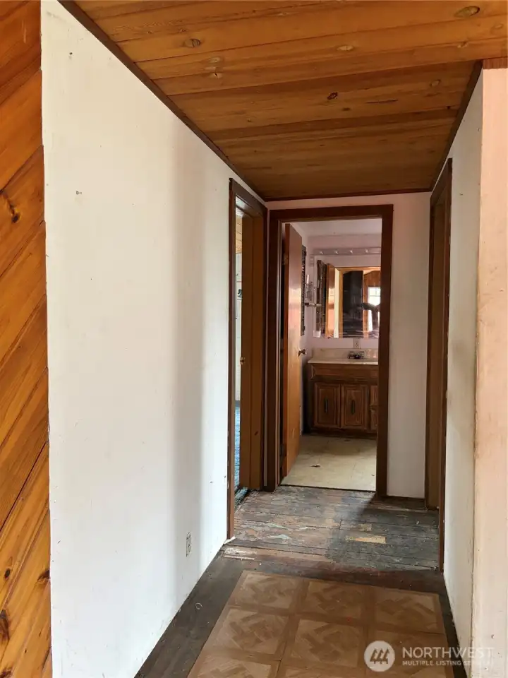 Hallway to bedrooms and full bath.