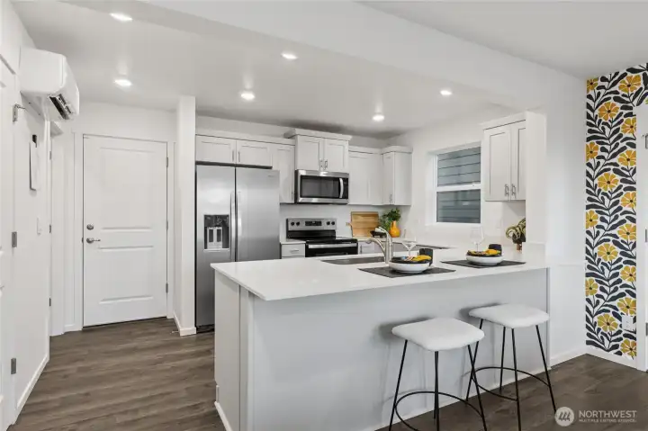 Center island with plenty of natural light, perfect for entertaining, casual dining, and everyday living.