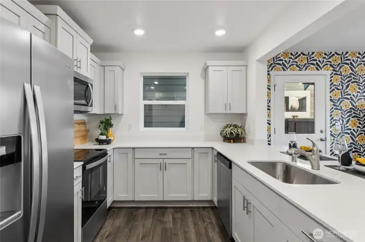 Spacious kitchen island with quartz countertops