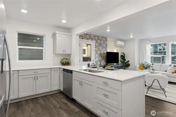 Spacious kitchen island with quartz countertops