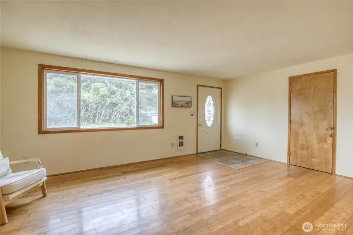 Large front living room offers flexible space for everyday living.