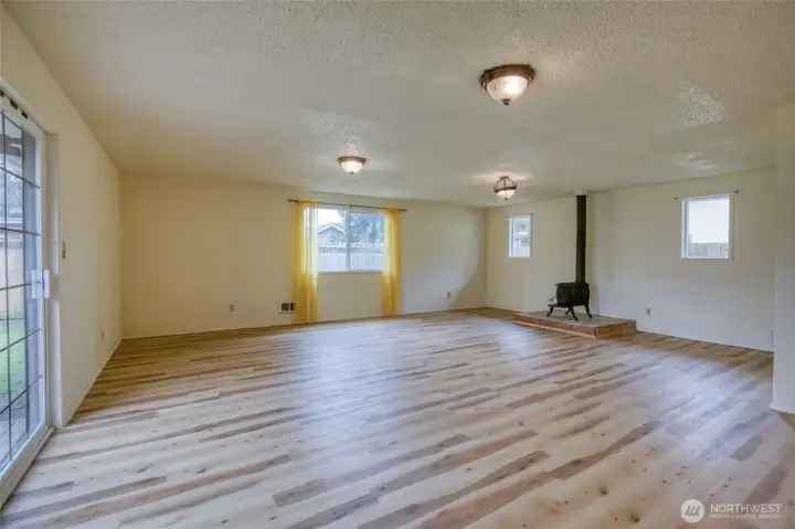 Expansive 500+ SF family room offers endless flexibility for gathering, games, movie nights, or multi-purpose living