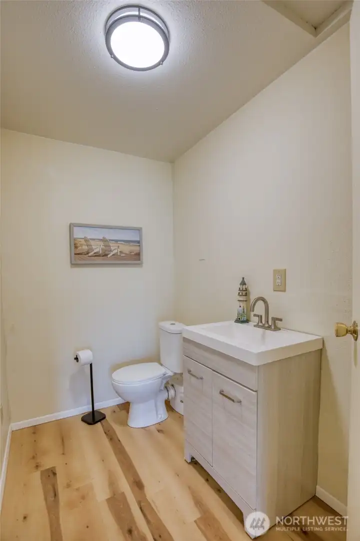 Half bath off family room for convenience.