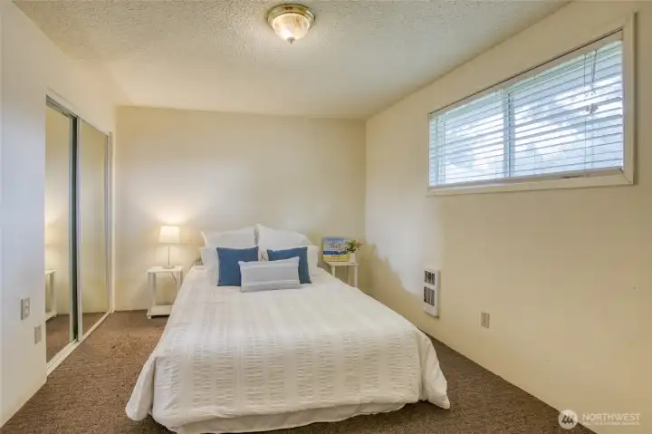 Comfortable primary suite tucked away from the home’s main living spaces