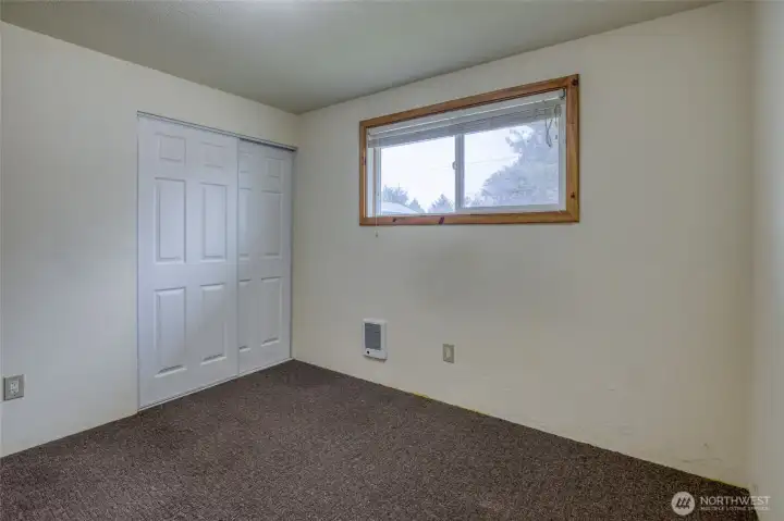 Peaceful secondary bedroom tucked away from the main living spaces