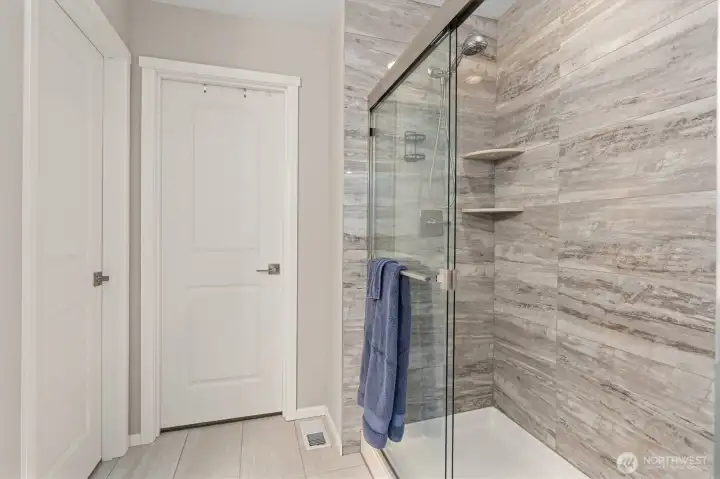 Primary bath with tiled walk-in shower
