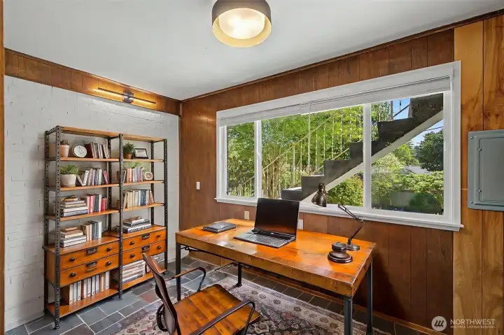 Virtually Staged - office with brick walls, book shelves, paneling, tile floor