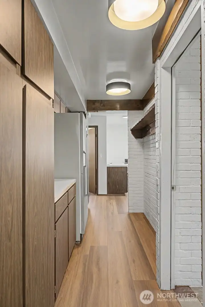 Extra storage in basement hallway with space for large fridge or freezer