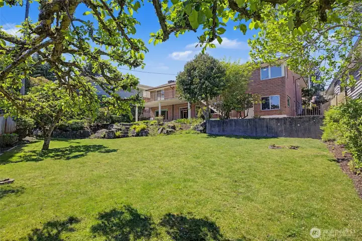 Beautiful backyard, spacious with plenty of space for play, entertaining, or gardening.