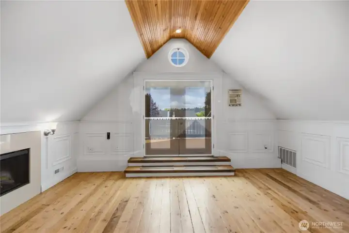 Upper floor open floor plan with cozy fireplace