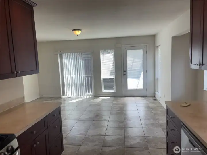INSIDE we are looking toward entrance to unit. Again, you find a very spacious open plan with easy maintenance tile floor in the living and kitchen area INSIDE we are looking toward entrance to unit. Again, you find a very spacious open plan with easy maintenance tile floor in the living and kitchen area
