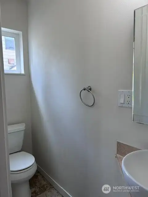 Powder room with window and tile floor Powder room with window and tile floor