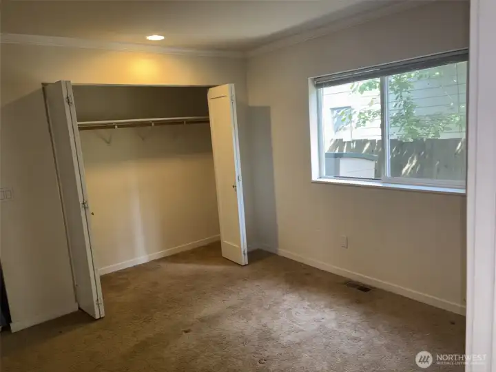 Primary bedroom with long closet for hanging clothes. Primary bedroom with long closet for hanging clothes.
