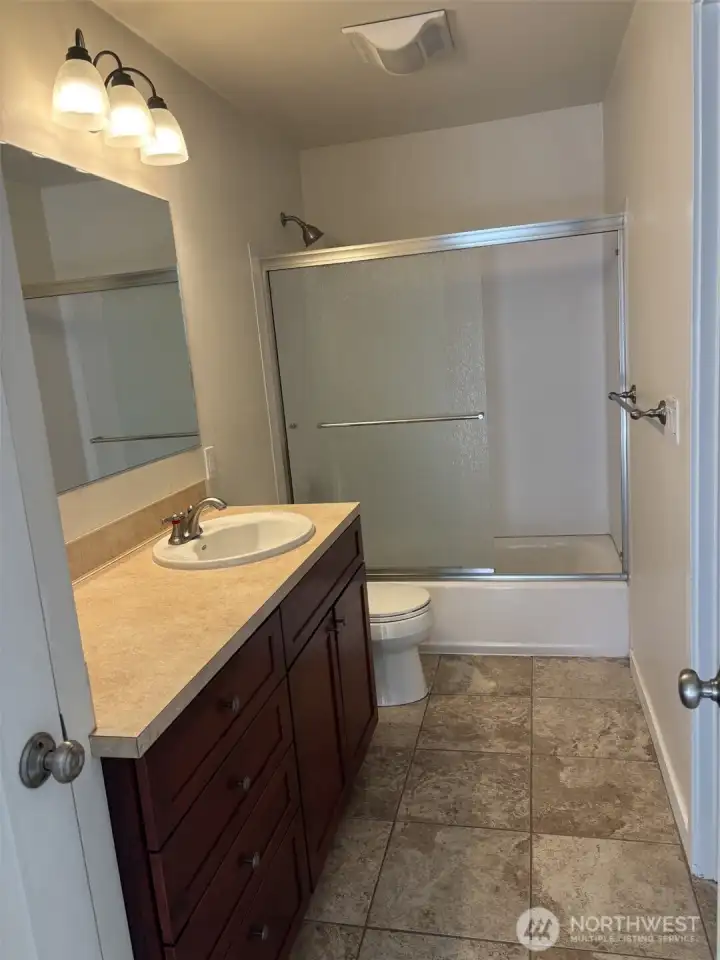 Primary bath has linen closet at left of vanity. Primary bath has linen closet at left of vanity.