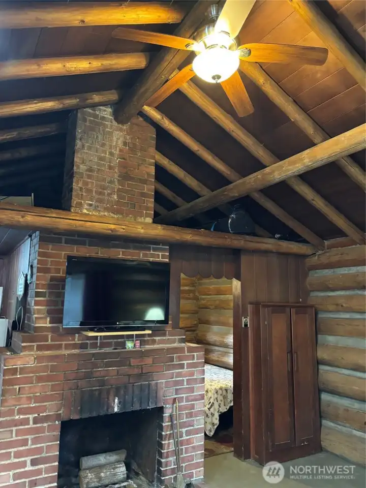 There are 2 loft areas above on either side of masonry chimney to place a bedroll or store tons of 'stuff' away There are 2 loft areas above on either side of masonry chimney to place a bedroll or store tons of 'stuff' away