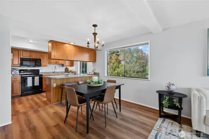 This spacious, light-filled open-concept kitchen features an effortless flow directly into the dining area.