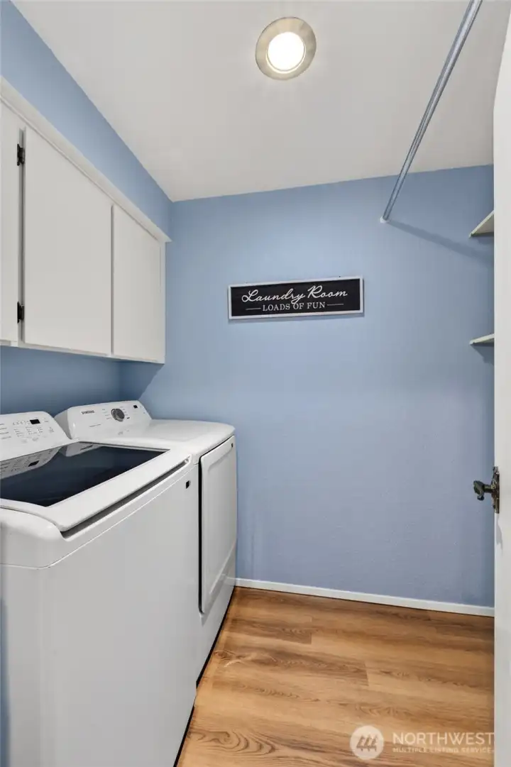 Laundry room w/extra storage and hanging bar