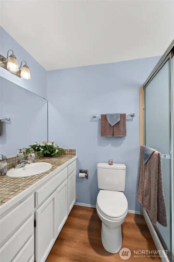 Primary Bath features a large walk in shower