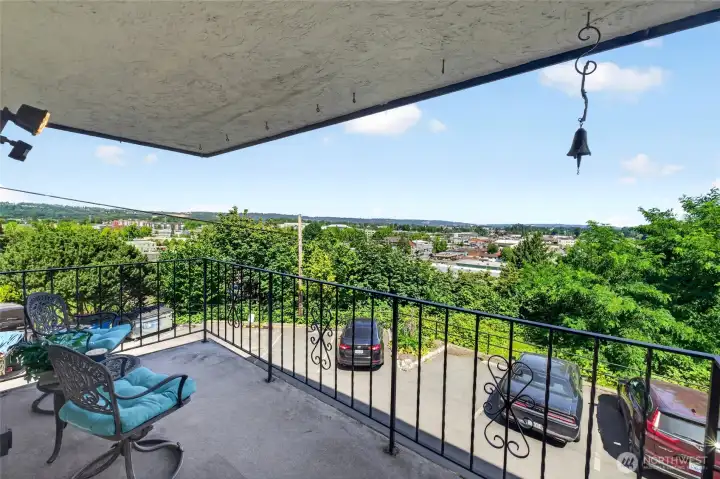 Spacious balcony featuring panoramic views and seamless indoor-outdoor living, perfect for morning coffee or evening relaxation.