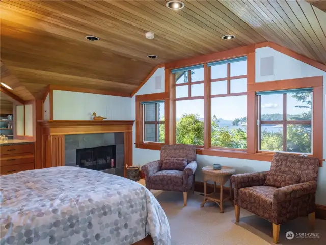 Primary bedroom windows frame the marine view.