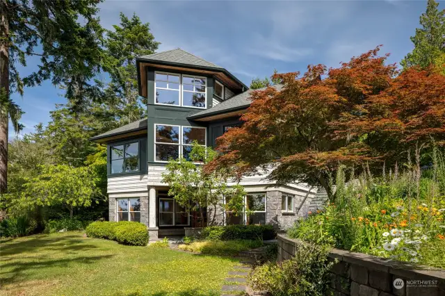 Mature gardens surround this home on 582 ft of waterfront.