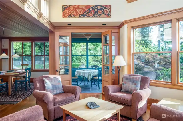 Another livingroom view looking into the "morning" screened porch with dining area to the left.