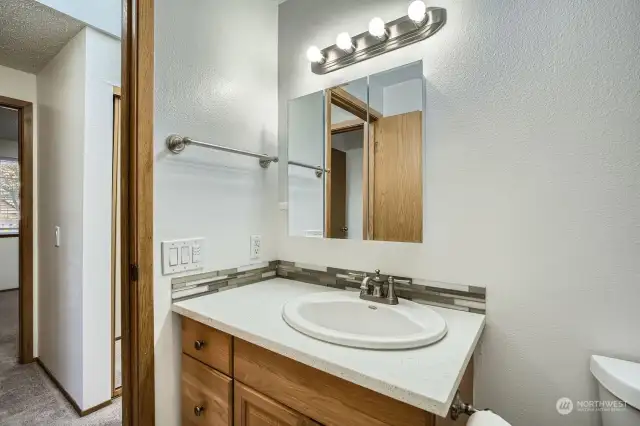 Hall bath, modern tile bath surround and new cabinet