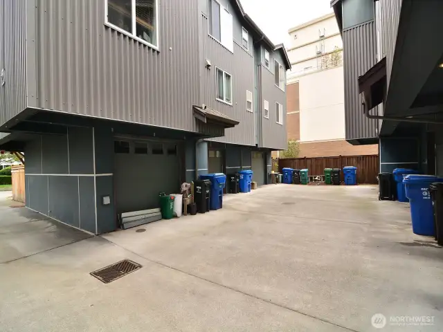 Rear part of the unit with private driveway to access garage.