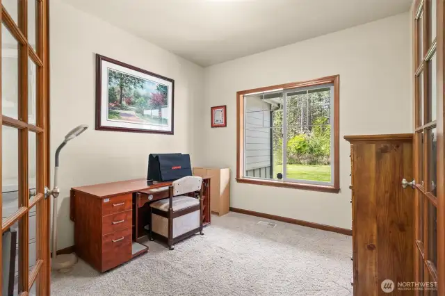 Ready to work from home, or run your home business. Partially gridded windows with views out into the front yard.