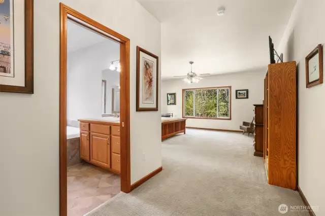 A second set of French doors lead into the Primary Suite. Have you noticed the real wood trim that is throughout the home? Beautiful.