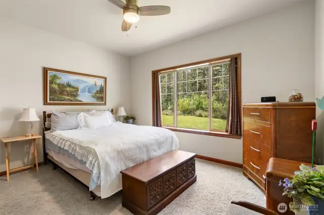One of two guest bedrooms. Ceiling fan.