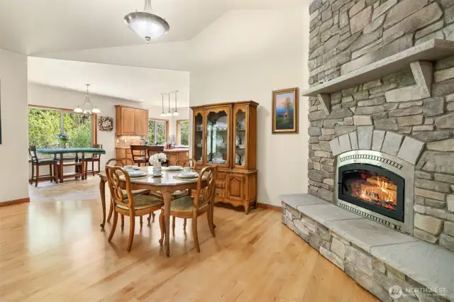 Floor to ceiling rock wraps the inset wood fireplace with glass door and built-in hearth and mantle. Mmmm cozy.