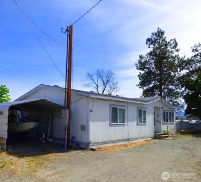 Front of the house with covered parking